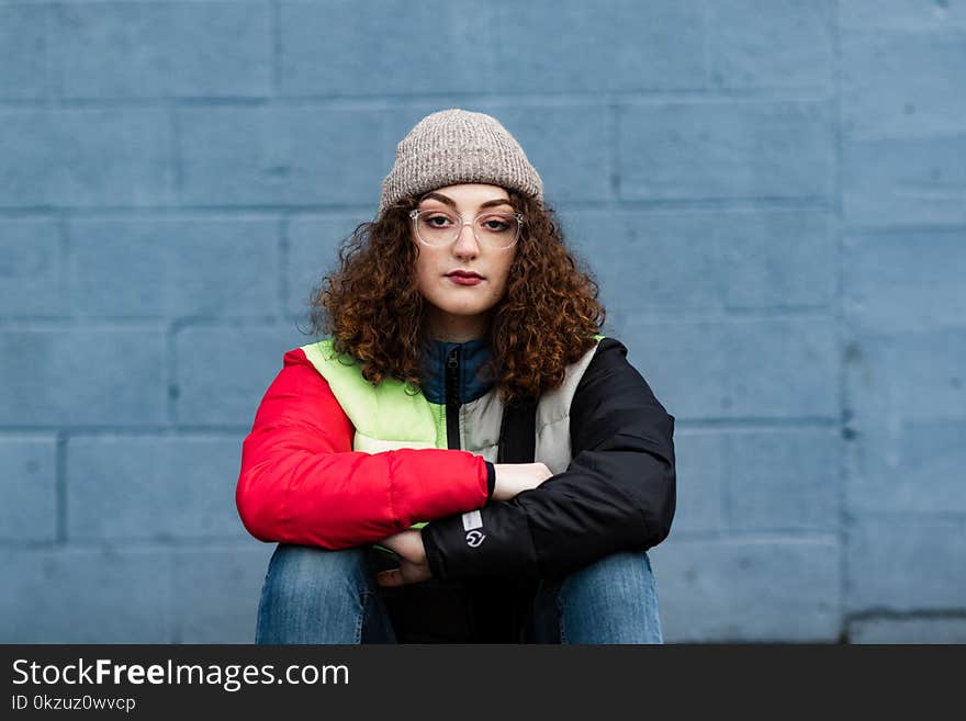 Woman Wearing Red and Black Zip-up Jacket