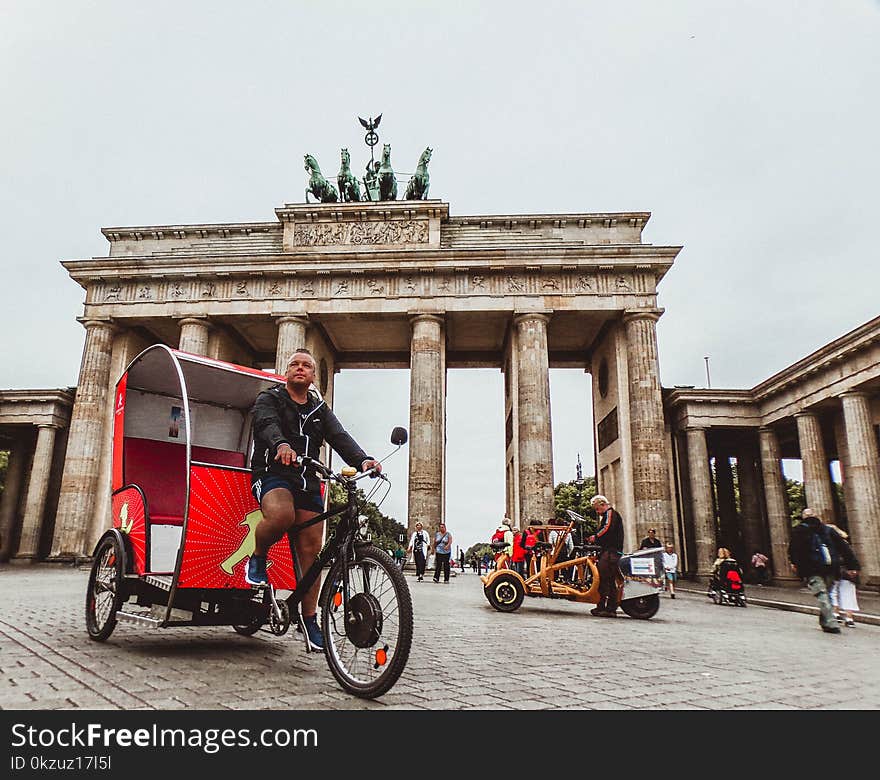 Man in Black Hoodie Riding Trike