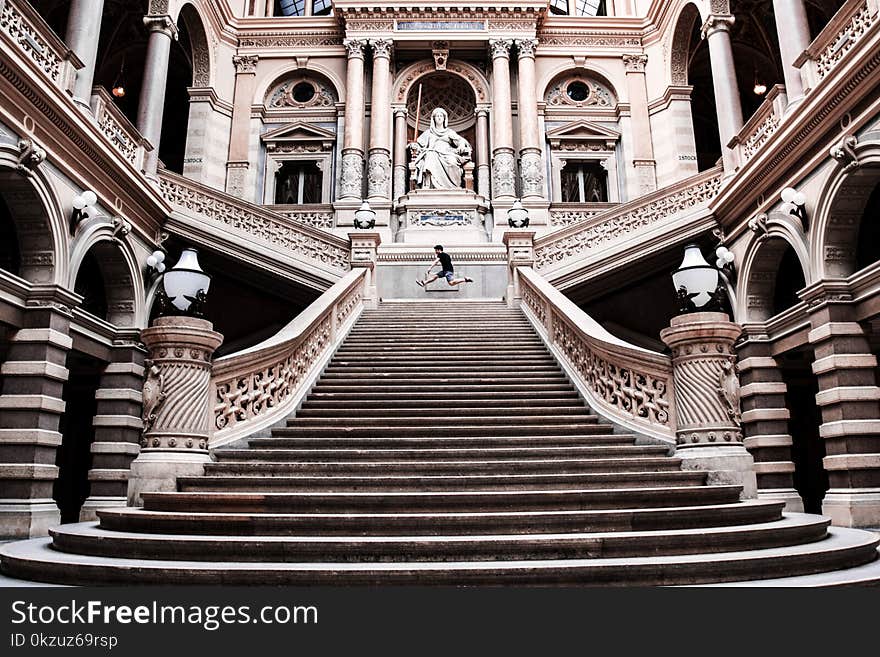 Man on Gray Concrete Staircase