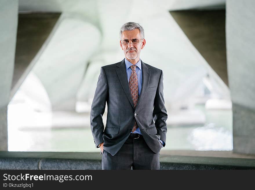 Selective Focus Photograph of Man Wearing Gray Suit Jacket