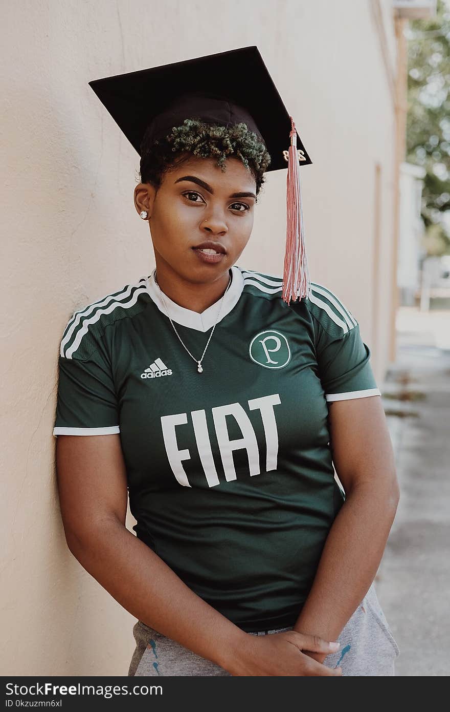 Woman Wearing Green And White Adidas Jersey T-Shirt