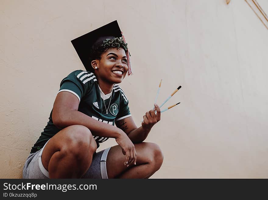 Woman Wearing Green And White Adidas Jersey Shirt