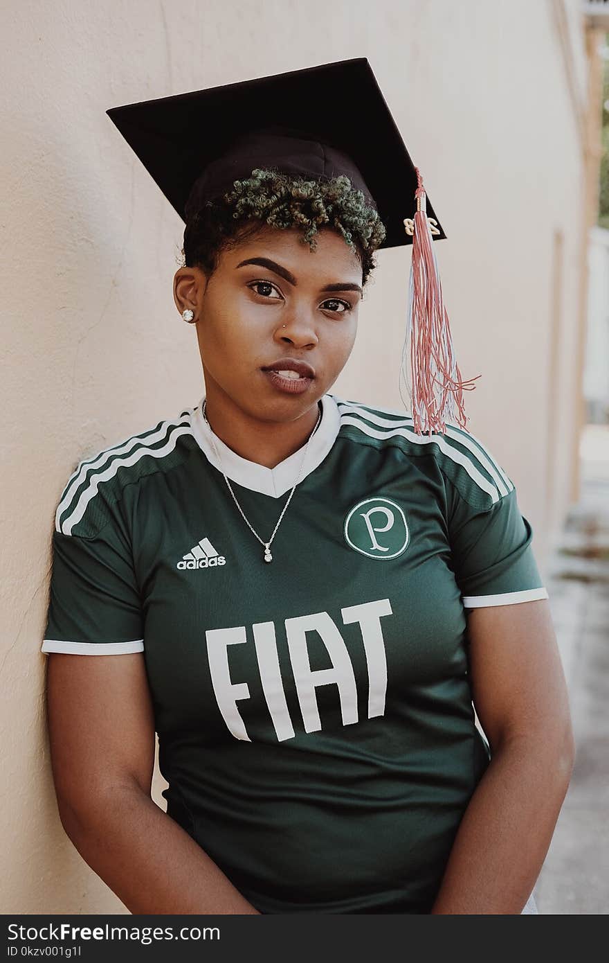 Woman Wearing Green And White Adidas Jersey Shirt