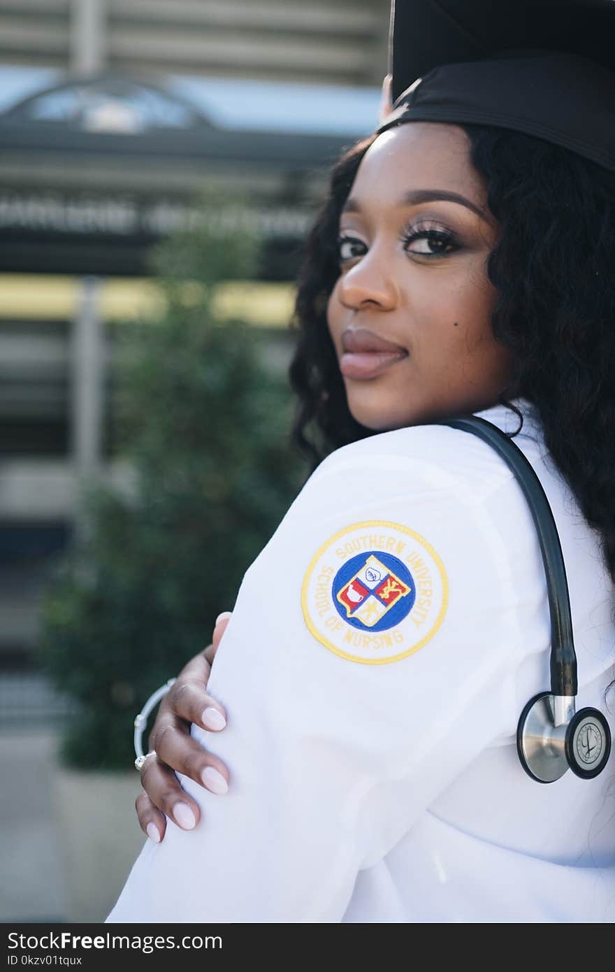 Woman Wearing White Long-sleeved Shirt And Stethoscope