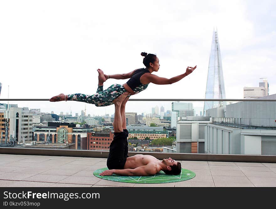 Man And Woman Doing Yoga