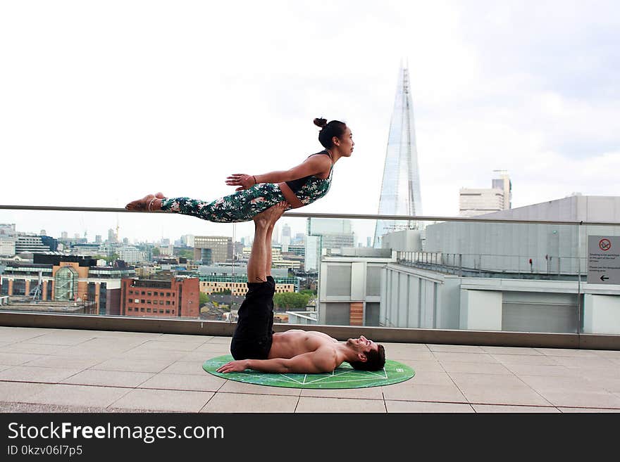 Photo Of Man Lifting Woman Using His Feet