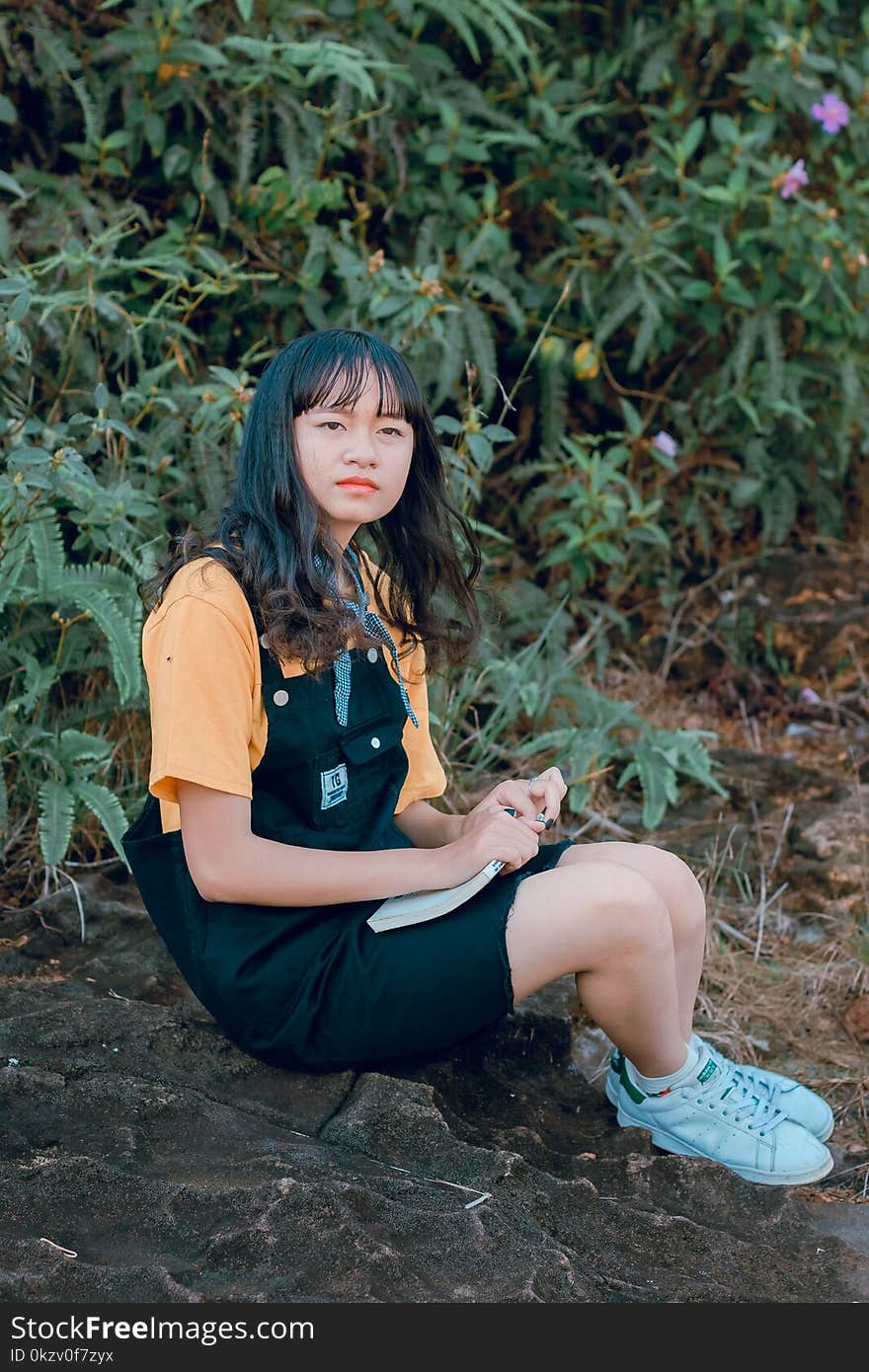 Girl in Black and Orange Shirt