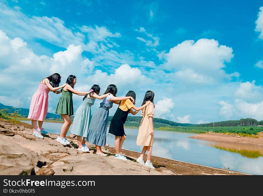 Six Women Standing Near Body Of Water