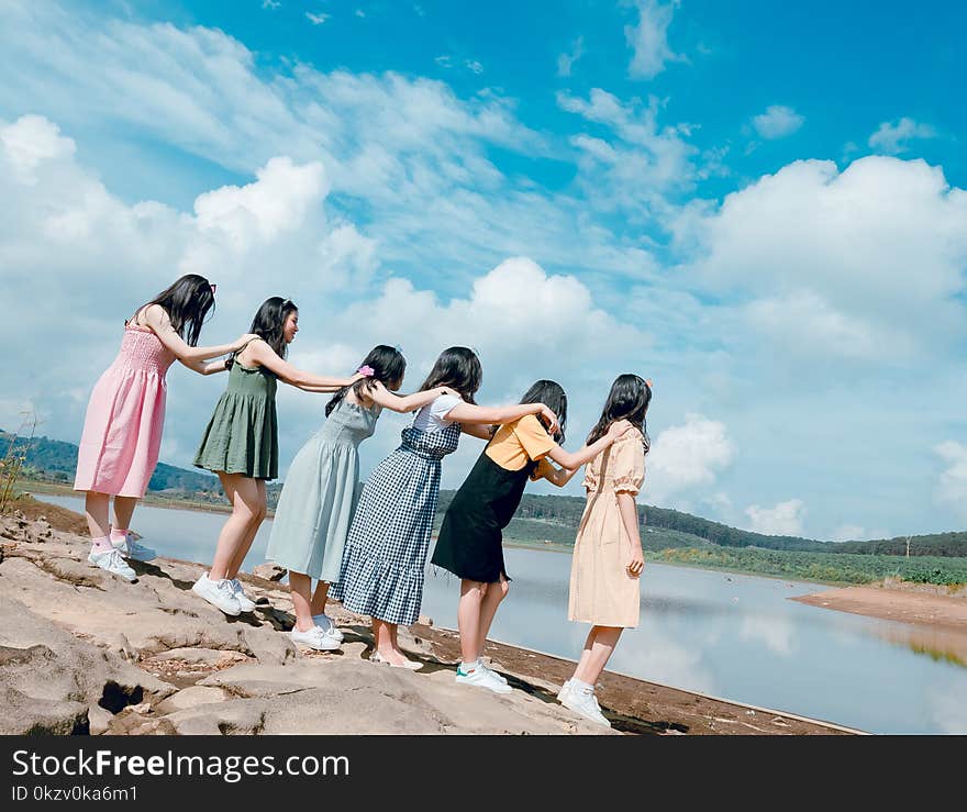 Six Women Standing Near Body Of Water