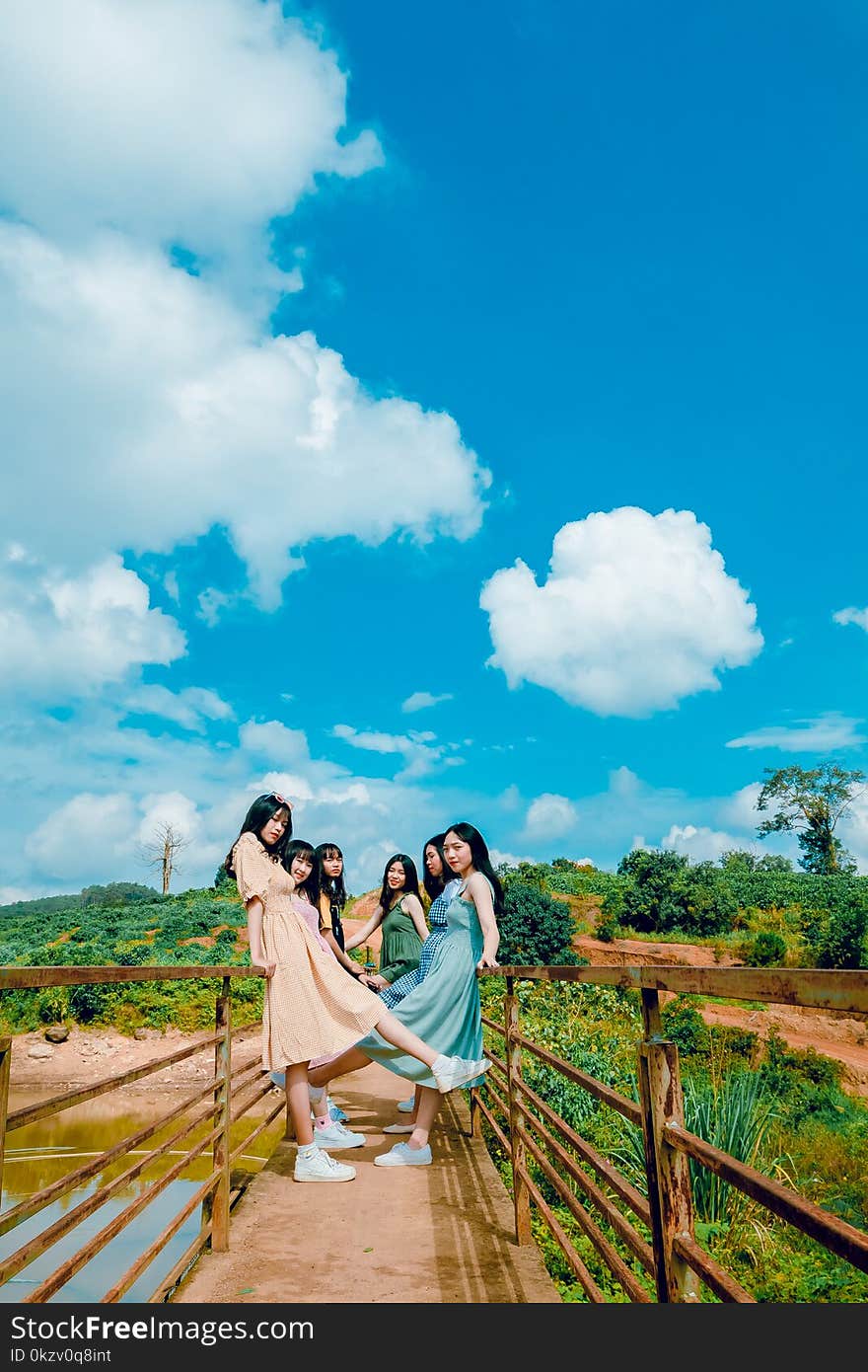 Six Girls Standing on Bridge