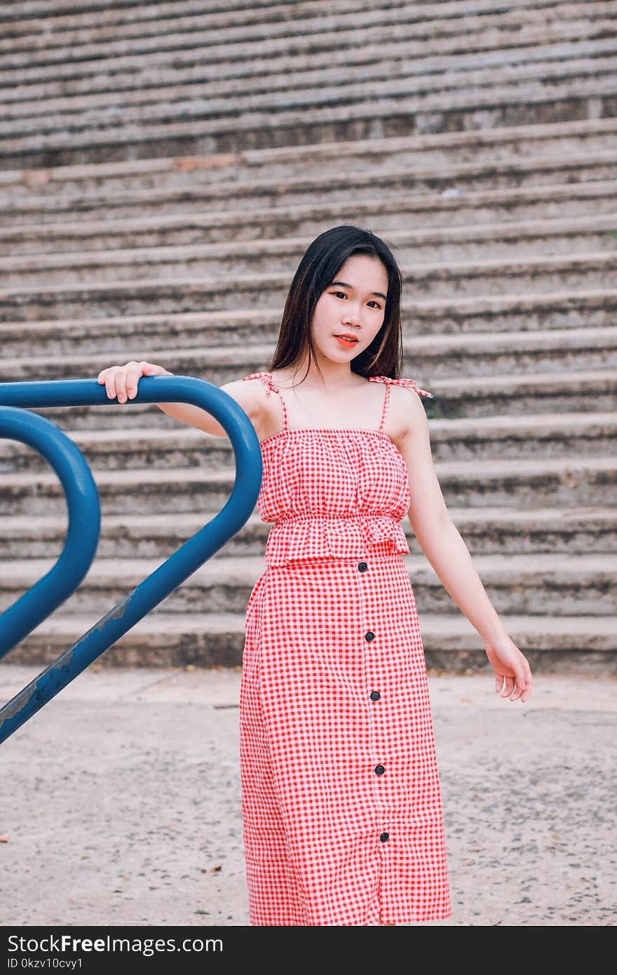 Woman in Red and White Spaghetti Strap Dress