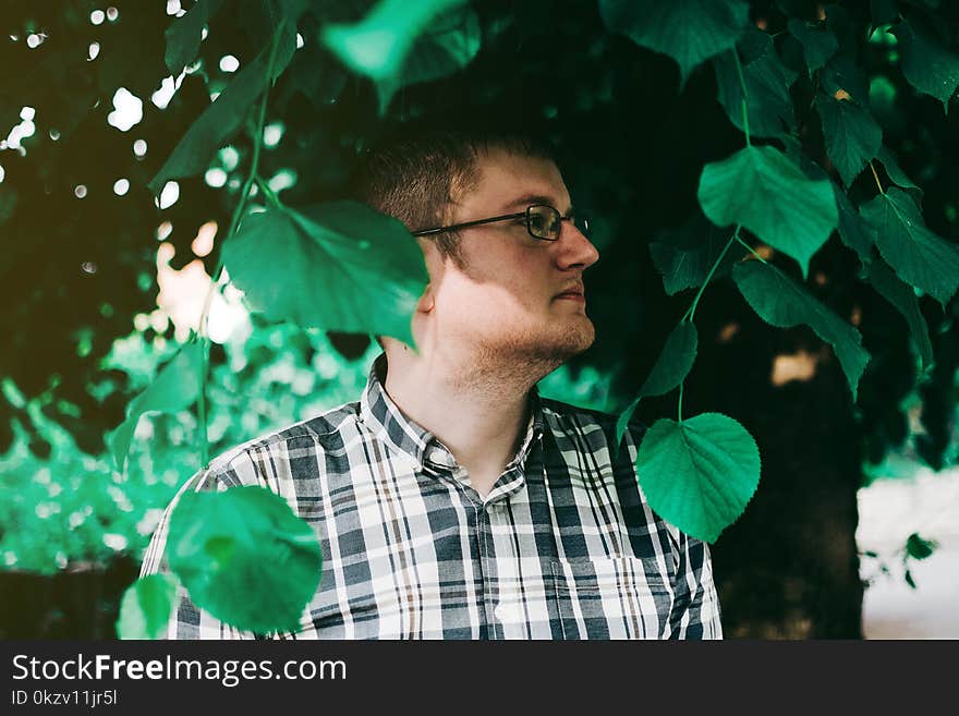 Man In Eyeglasses Standing Under Tree