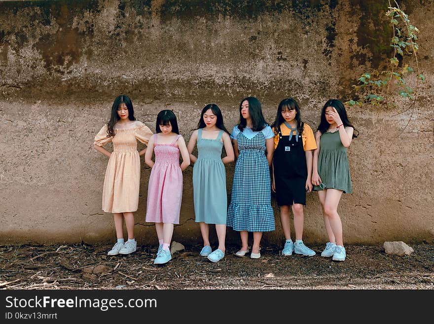 Six Girls Leaning on Wall