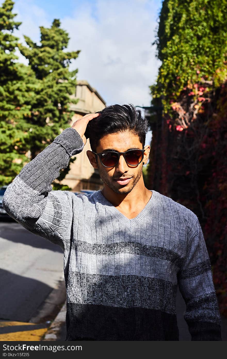 Man Wearing Gray and Black V-neck Sweater