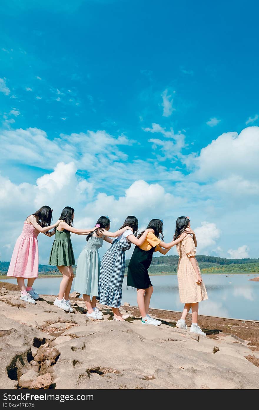 Six Women Standing By The Lake