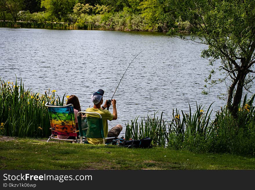 Fishing Man Wearing Yellow Shirt