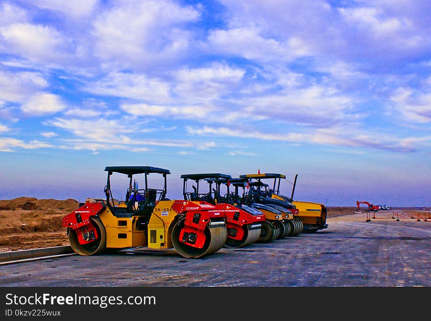 Red and Yellow Heavy Equipment at Daytime