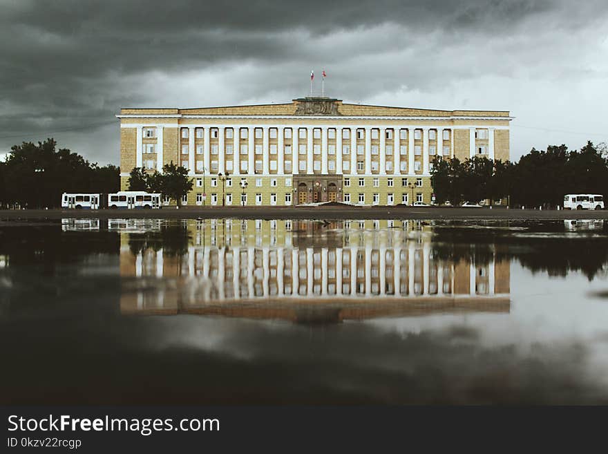 White and Beige Concrete Building Near Water