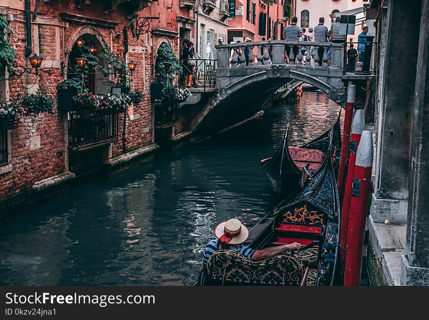 Photo of Man Riding Canoe