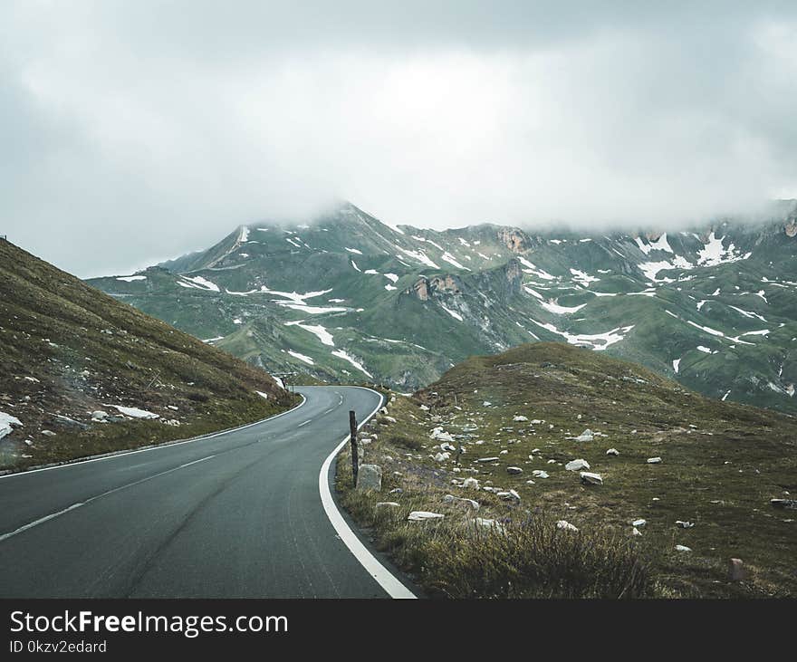 Gray Concrete Pavement Under White Cloudy Sky