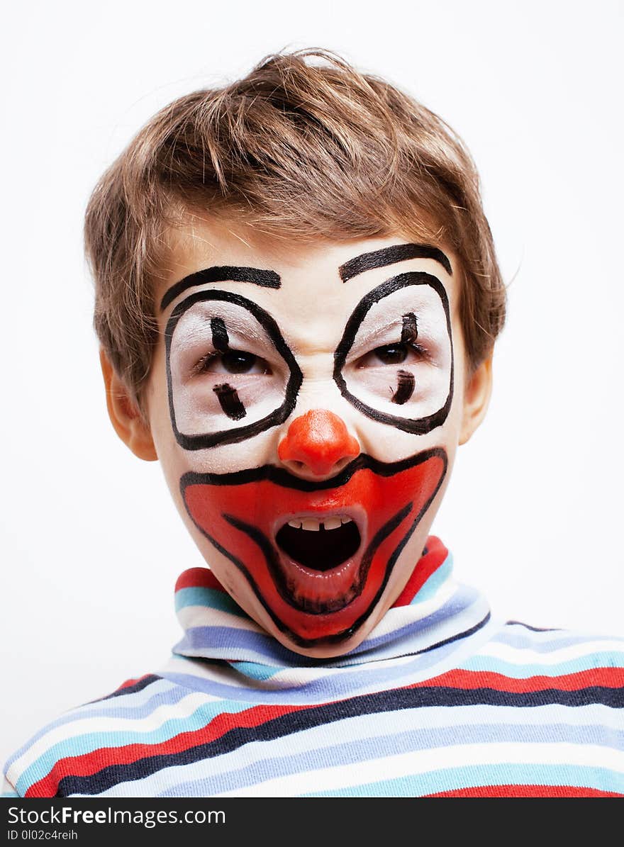 Little cute real boy with facepaint like clown, pantomimic expressions close up