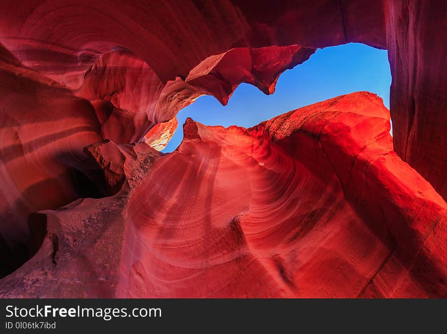 Beautiful wide angle view of amazing sandstone formations in famous Antelope Canyon on a sunny day with blue sky near the old town of Page at Lake Powell, American Southwest, Arizona, USA. Beautiful wide angle view of amazing sandstone formations in famous Antelope Canyon on a sunny day with blue sky near the old town of Page at Lake Powell, American Southwest, Arizona, USA