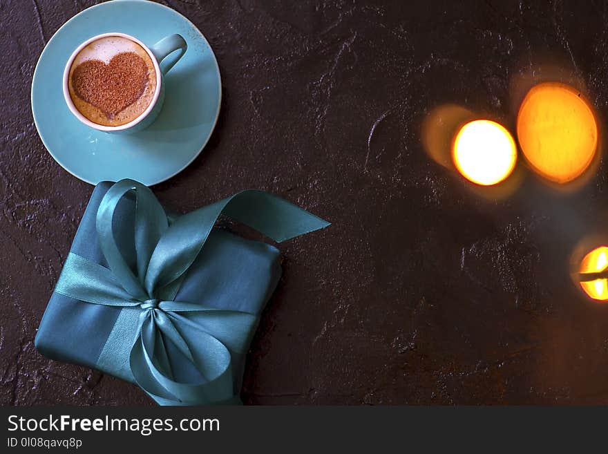 Coffee in a mint cup with a heart pattern