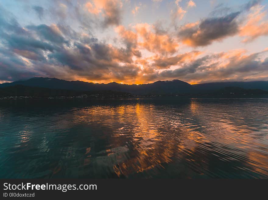 Reflect Photography of Body of Water Near Island