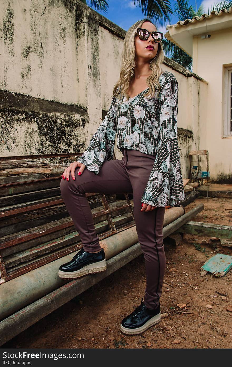 Woman Wearing White, Green, and Gray Floral Long-sleeved Top and Gray Pants