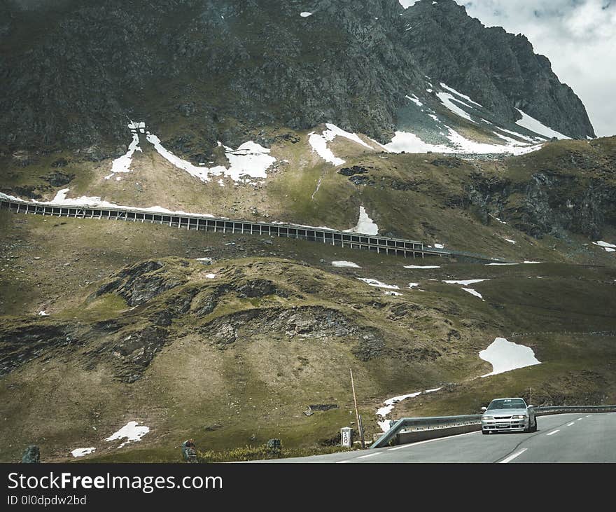 Silver Car on Road Near Mountain at Daytime