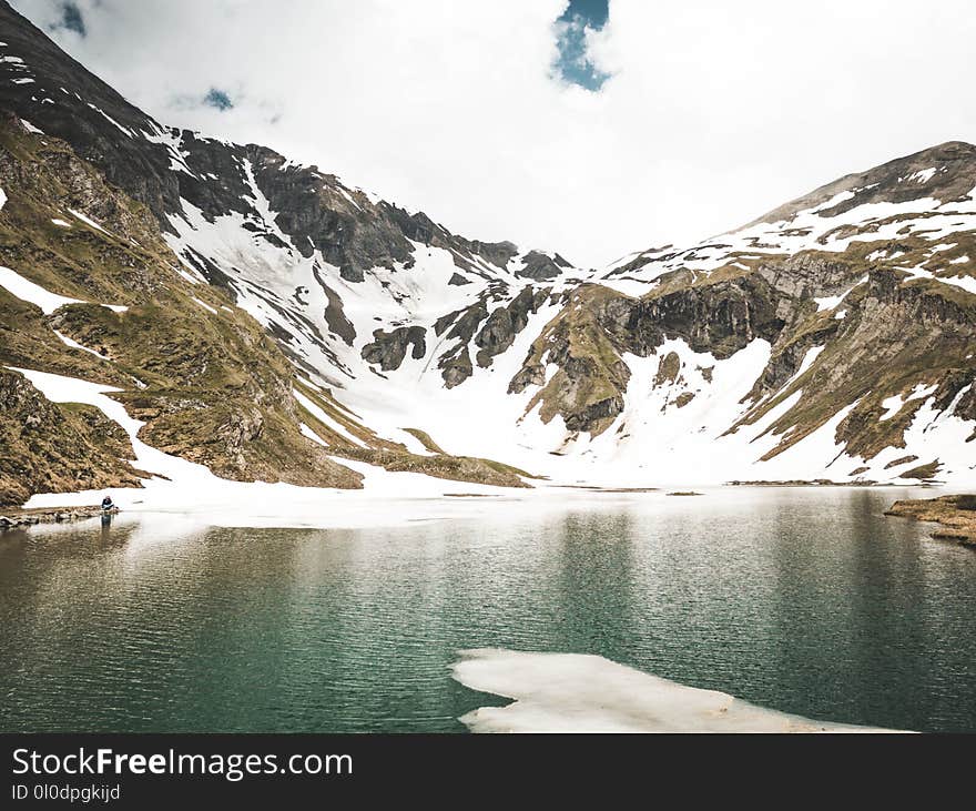 Snowy Mountain and Body of Water