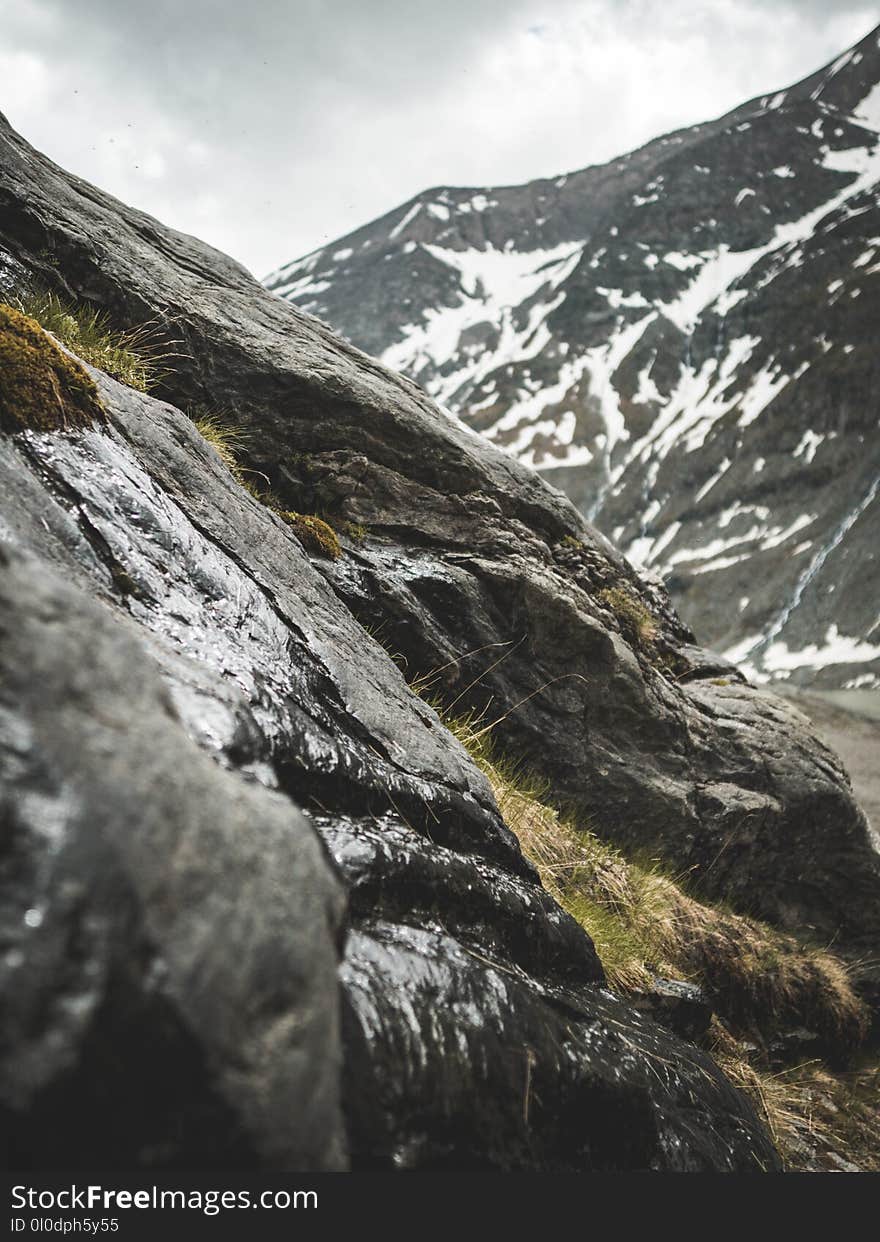 Rocky Mountain With Green Grasses at Daytime