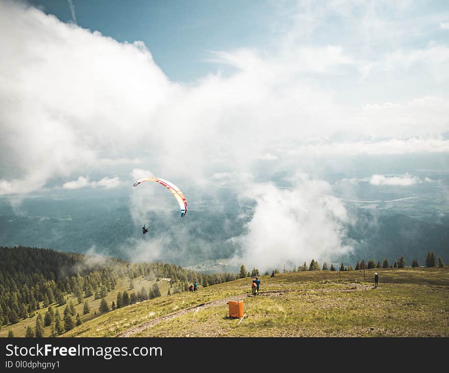 Person Riding on Parachute