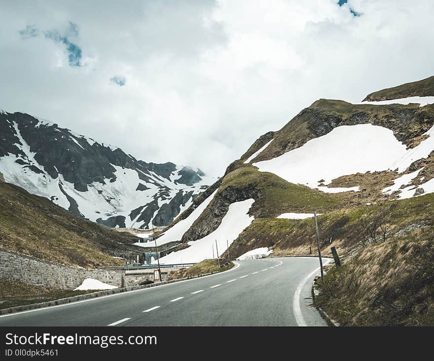 Scenic View of Mountains Under Cloudy Sky