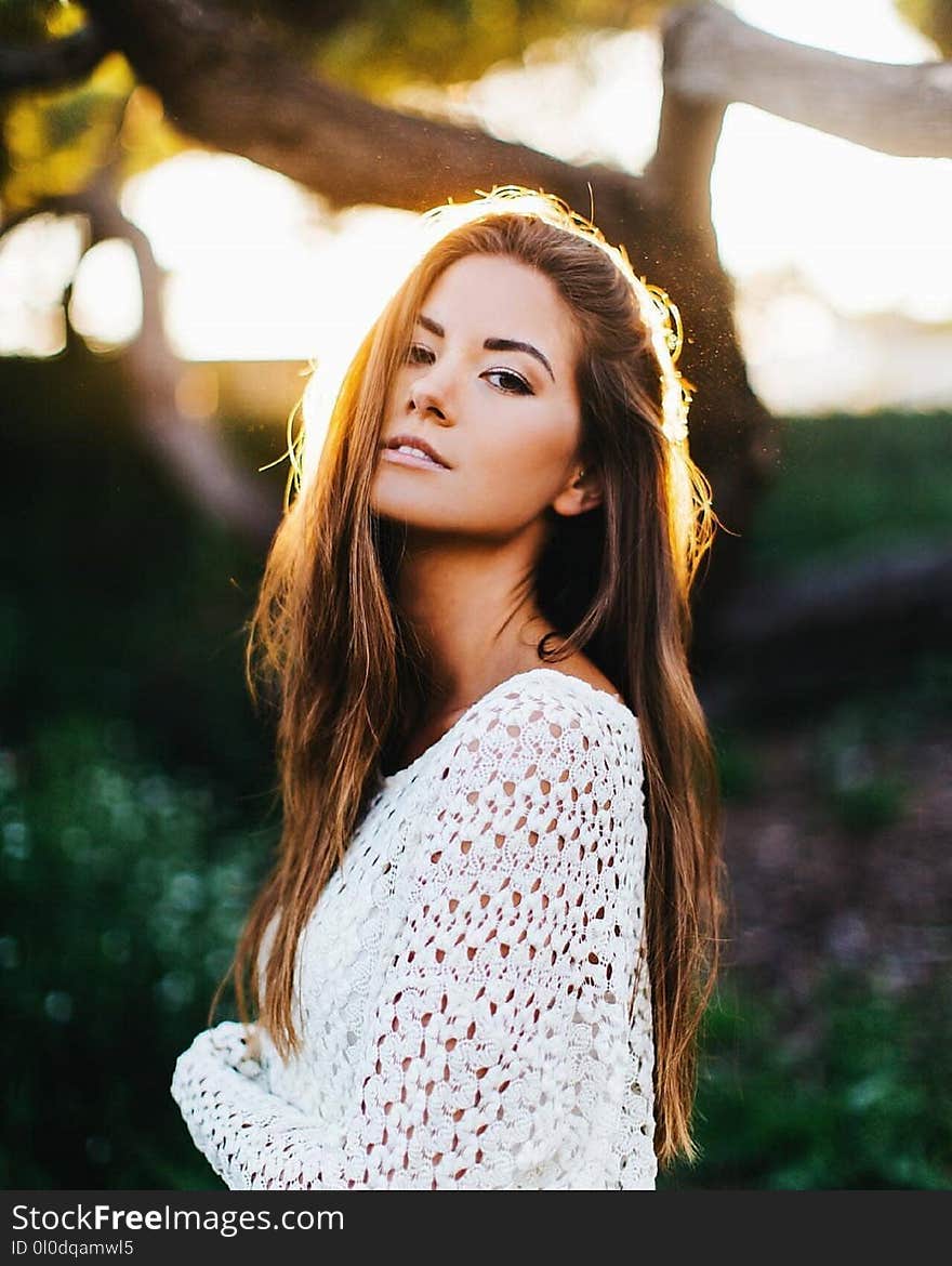 Photo of Woman Wearing White Crochet Cardigan