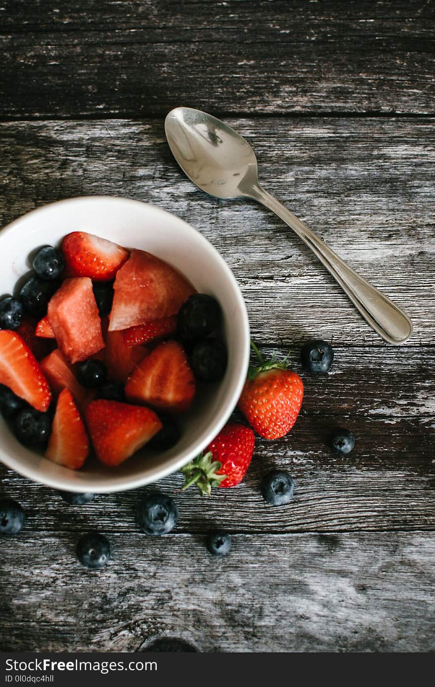 Photography of Strawberries And Blueberries On Bowl