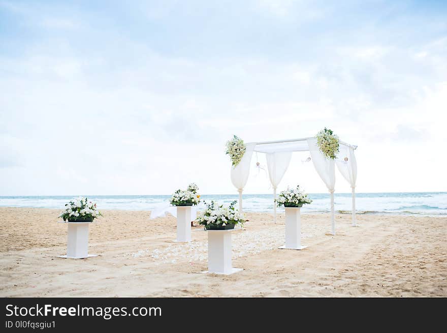 Romantic Wedding setting on the beach and blue sky.