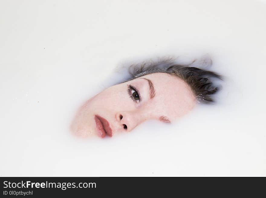 Woman&#x27;s Face on White Liquid