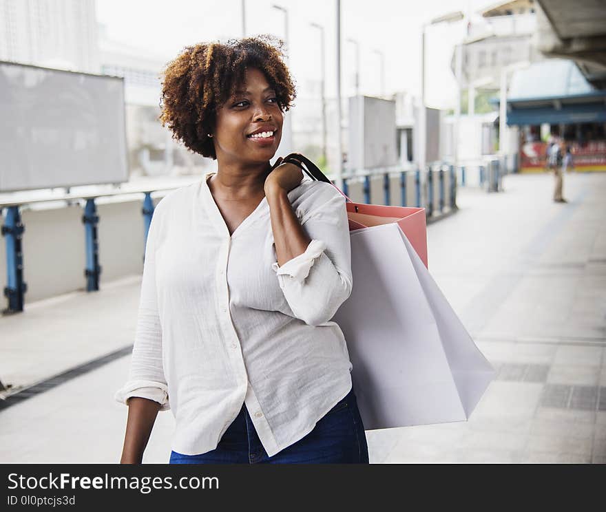 Woman in White Collared Button-up Long-sleeved Top Carrying White Bag