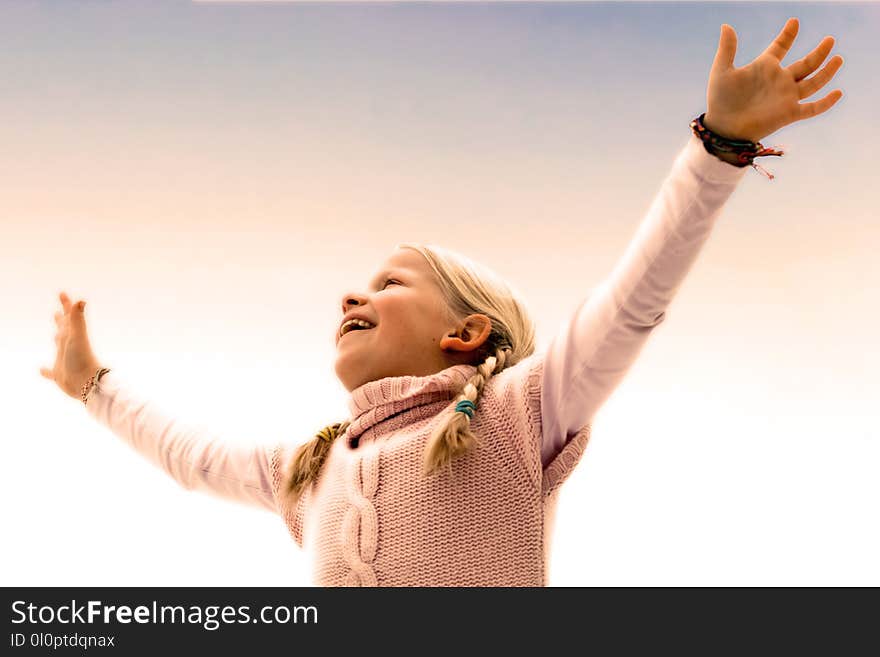 Blonde Haired Girl Wearing Pink Sweater