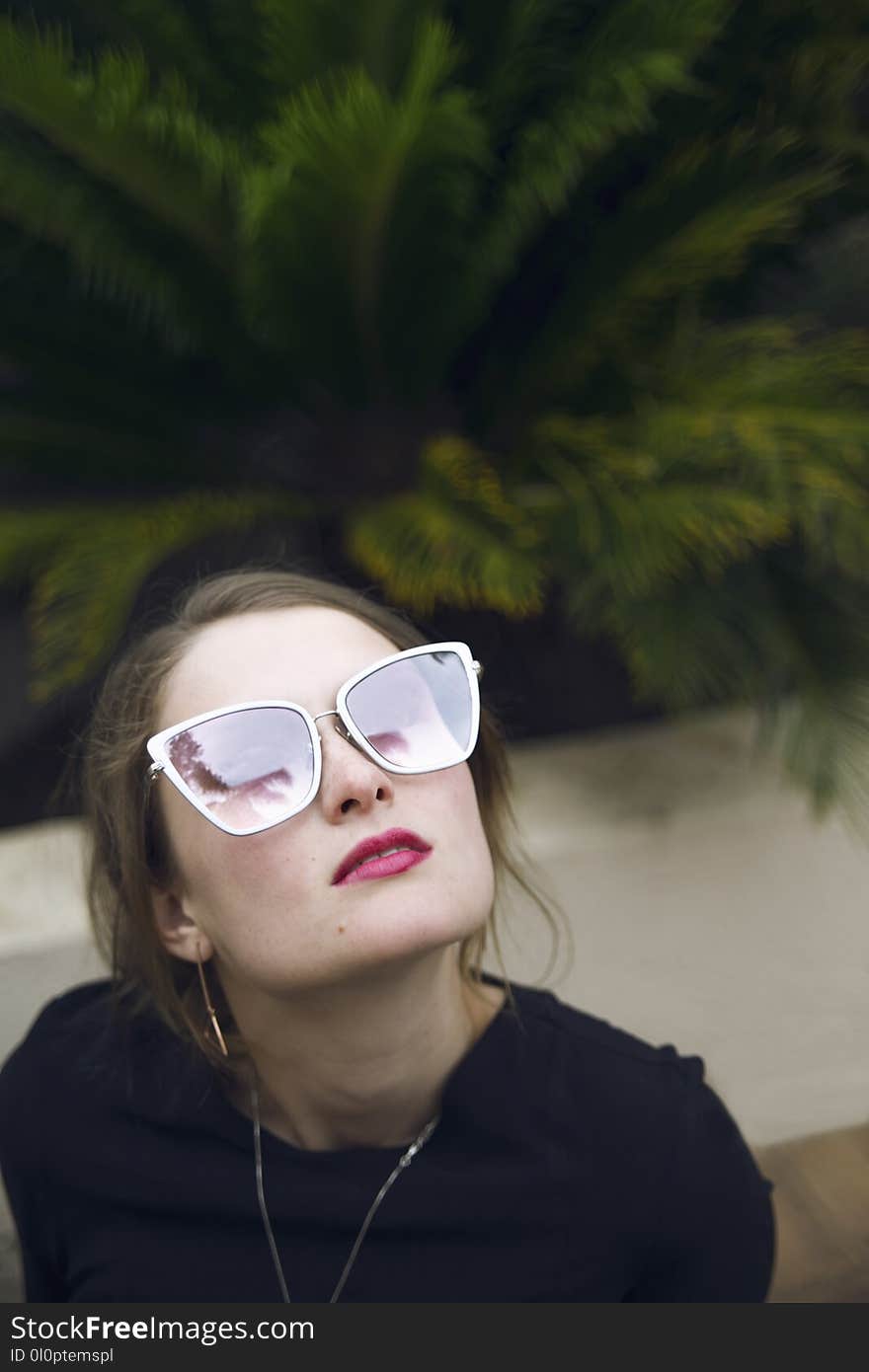 Photo of Woman Wearing Black Top and Sunglasses