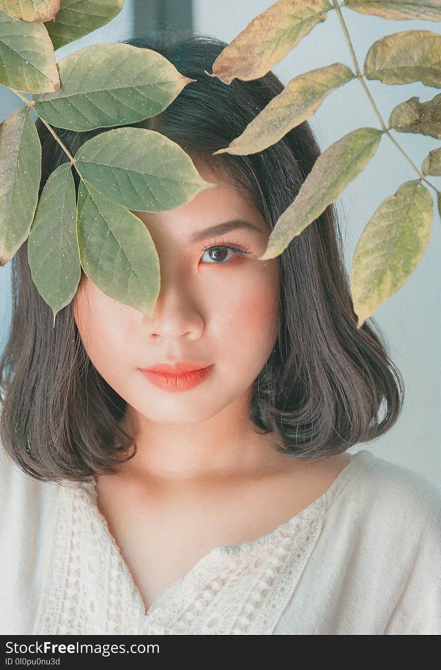 Closeup Photo of Woman Wearing White Sweater