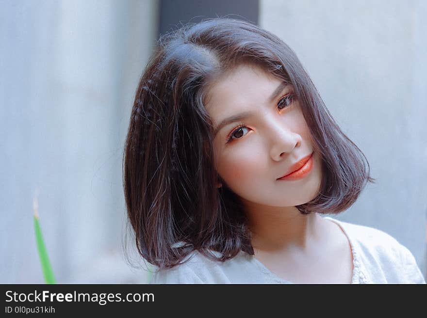 Selective Focus Photography of Woman Wearing White Shirt