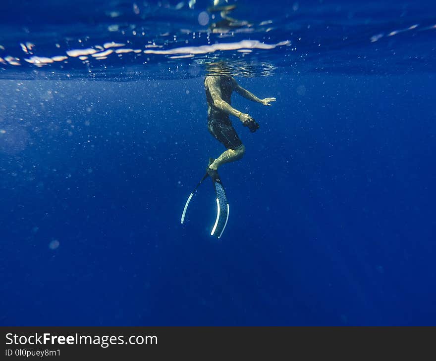 Man Underwater Photo