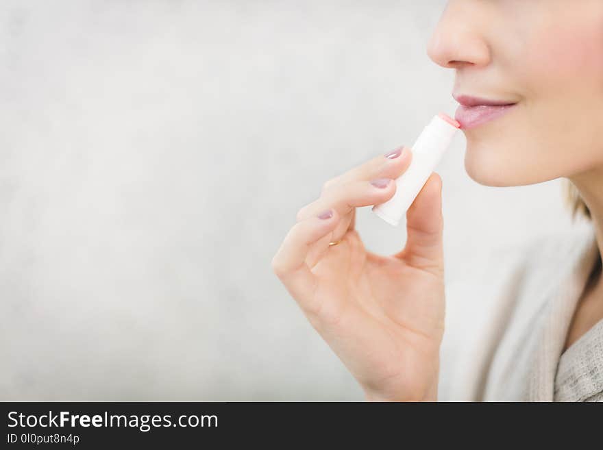 Woman About to Apply Pink Lip Balm