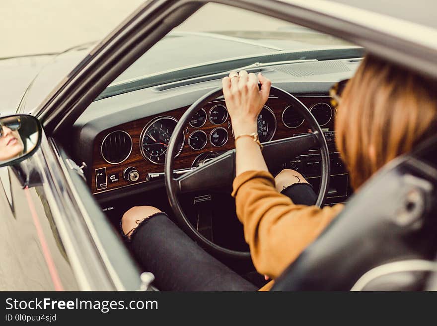 Woman Riding on Black Vehicle