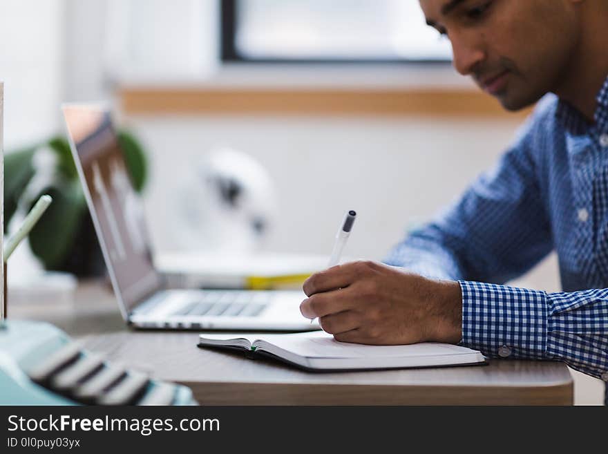 Photo of Man Using Laptop