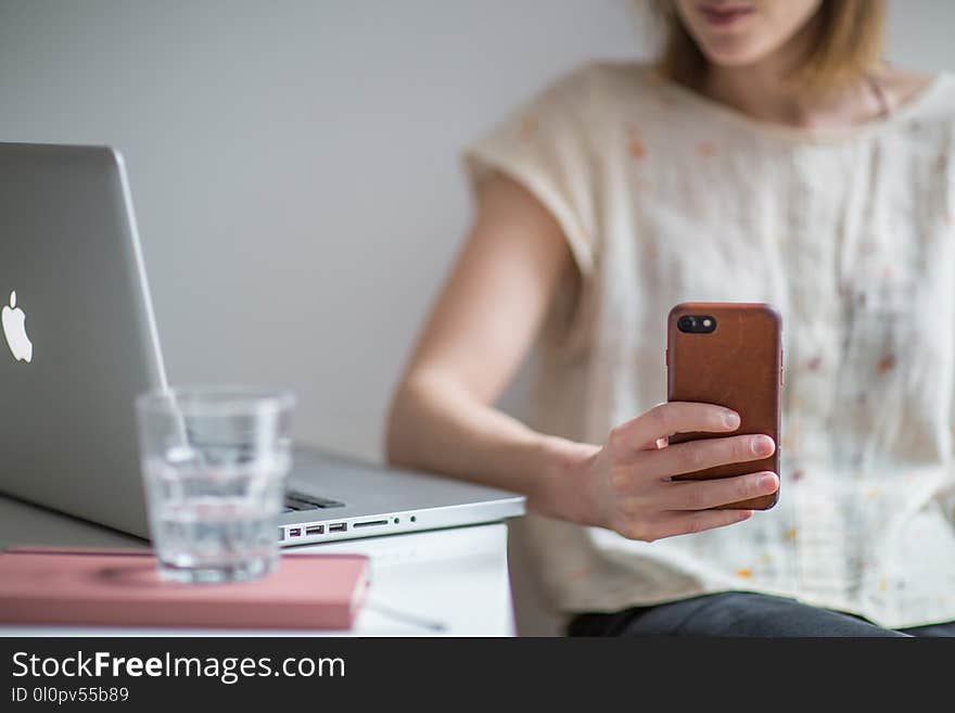 Photo of Woman Holding Smartphone