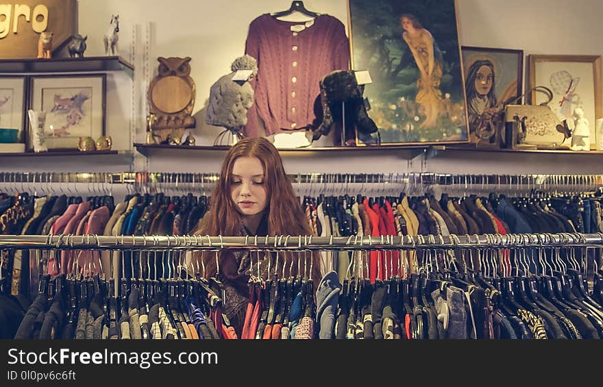 Photo of Woman Near Clothes