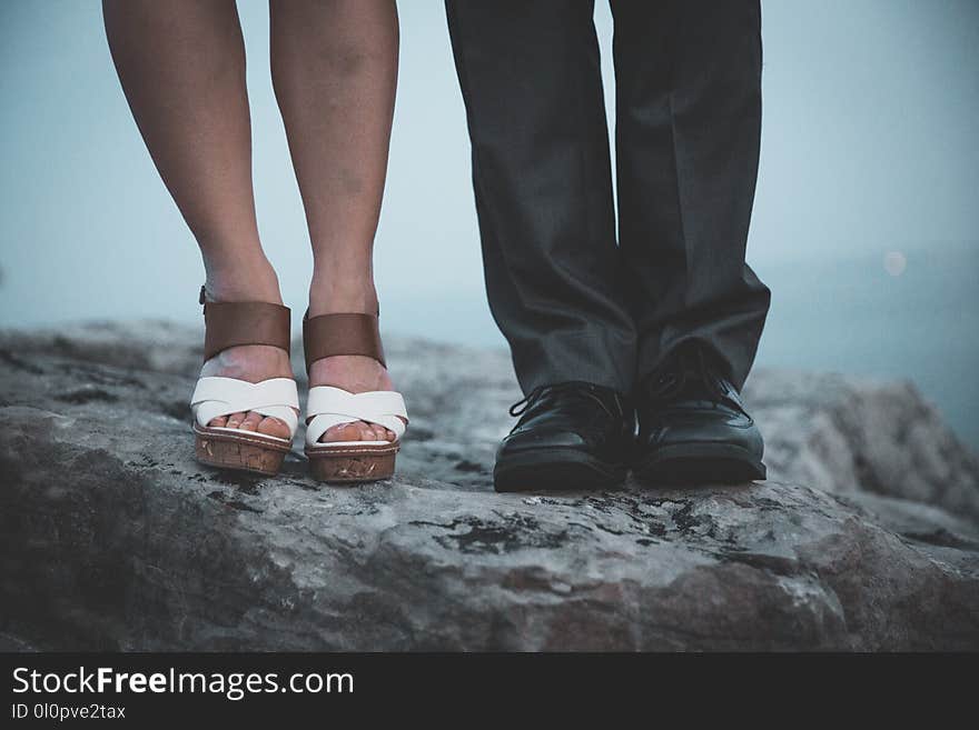 Closeup Photo of Two Person&#x27;s Legs